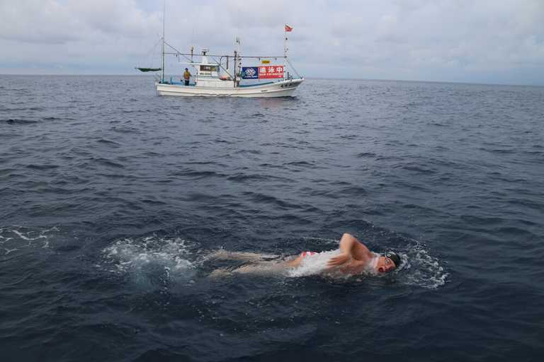 Lyton Mortensen swimming in open ocean